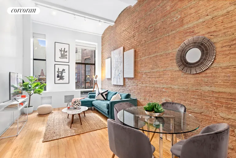 New York City Real Estate | View 39 East 12th Street, 203 | High ceilings, exposed brick & over-sized windows! | View 3