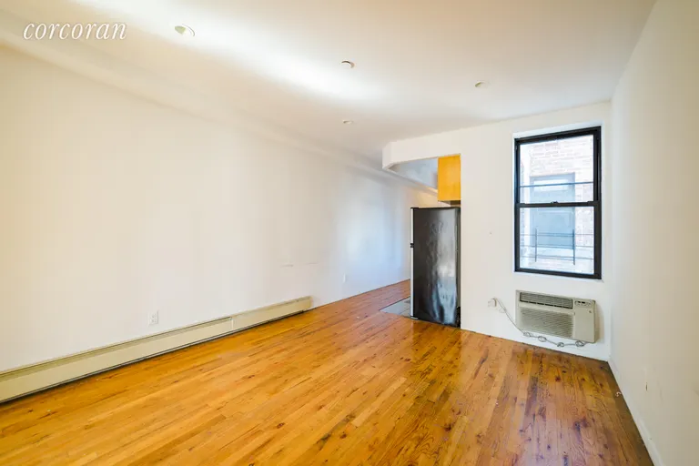 New York City Real Estate | View 407 West 51st Street, 5C | Living room with through the wall AC | View 3