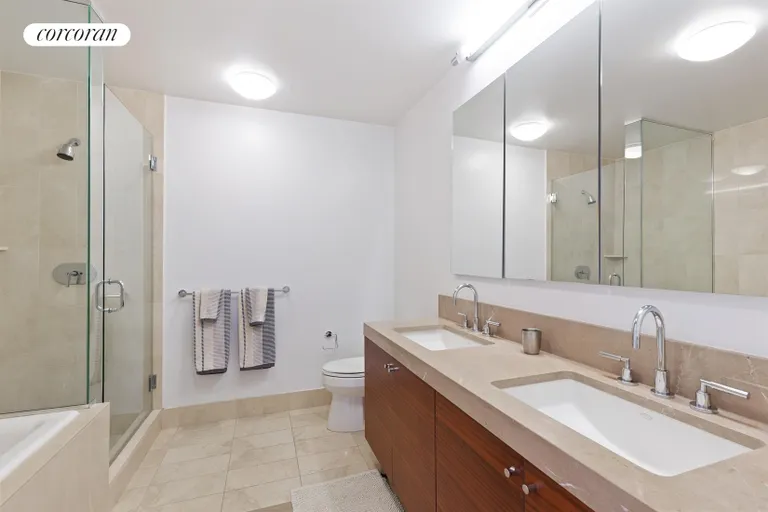 New York City Real Estate | View 30 West Street, 12F | Marble Master Bathroom | View 4