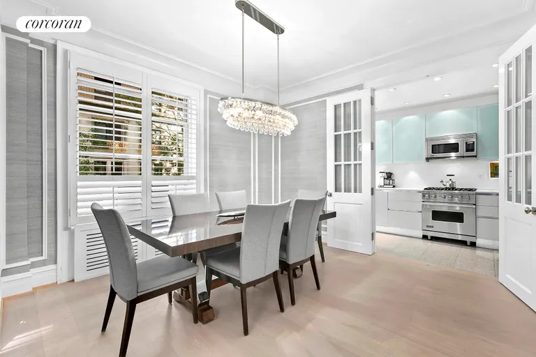 New York City Real Estate | View 780 West End Avenue, 2A | French glass doors open to renovated kitchen | View 2