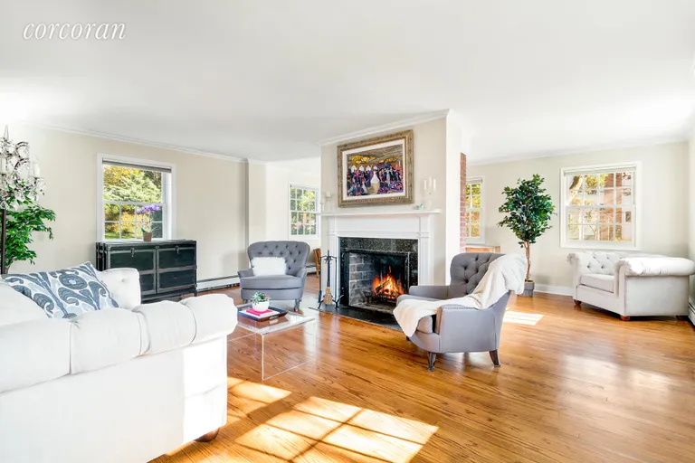 New York City Real Estate | View 109 Sea Gate Road | Spacious Living Room w/ Wood-burning Fireplace | View 2