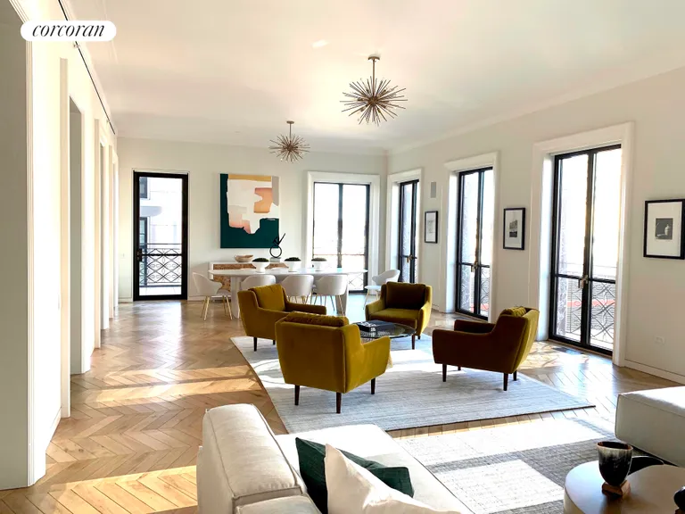 New York City Real Estate | View 560 West 24th Street, 7FLR | Sunlit great room with 7 Juliette balconies  | View 4