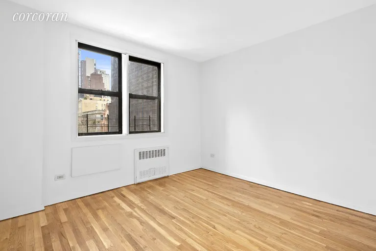New York City Real Estate | View 200 East 28th Street, 5B | Bedroom with Sound proof windows and Skyline views | View 3