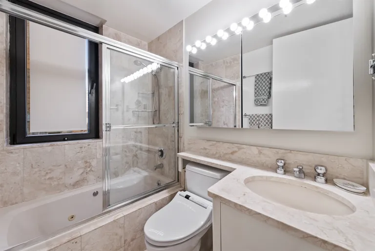 New York City Real Estate | View 100 United Nations Plaza, 7G | Windowed en suite master bathroom | View 4