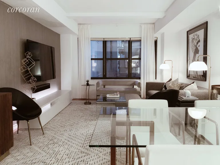New York City Real Estate | View 140 East 56th Street, 12J | Living Room (please note photo taken in evening) | View 2