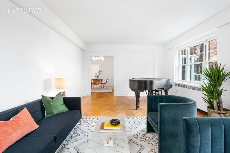 New York City Real Estate | View 200 Cabrini Boulevard, 16 | Living Room Flows into Dining Room | View 2
