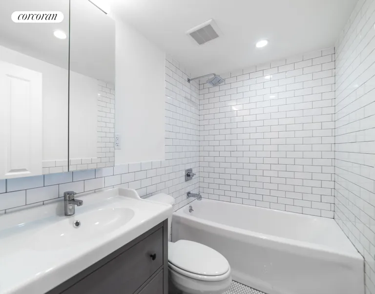 New York City Real Estate | View 1414 Saint Marks Avenue, 1 | Beautifully tiled bathroom with rainforest shower | View 8