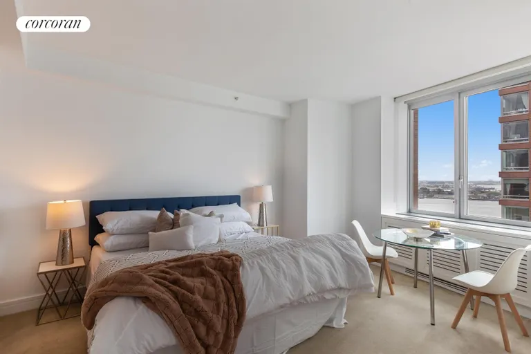 New York City Real Estate | View 30 West Street, 27E | Master Bedroom with River Views | View 14