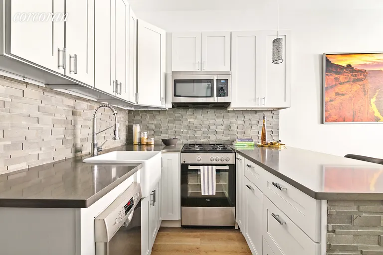 New York City Real Estate | View 148 East 84th Street, 2B | Brand new open kitchen with breakfast bar | View 2