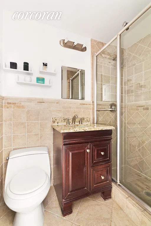 New York City Real Estate | View 148 East 84th Street, 2B | Updated bathroom with walk-in tiled shower | View 4
