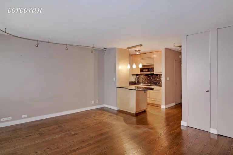 New York City Real Estate | View 77 West 55th Street, 8A | Kitchen & Living Room | View 3