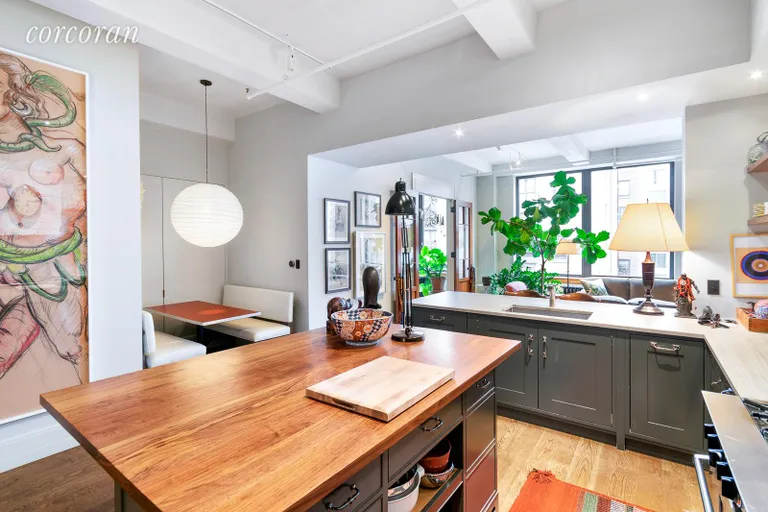New York City Real Estate | View 142 West 26th Street, 9 FL | Kitchen with eat-in dining table | View 4