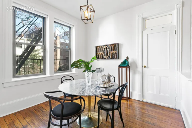 New York City Real Estate | View 331 West 19th Street, 3 | Large dining room overlooking gardens | View 2