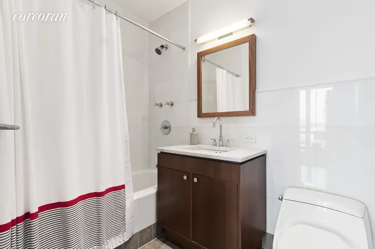 New York City Real Estate | View 10 West End Avenue, 8C | Bathroom with Kohler bathtub and Grohe fixtures | View 9