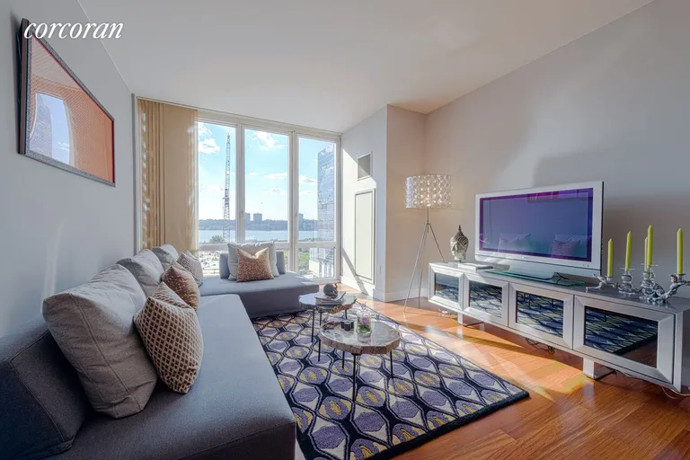 New York City Real Estate | View 10 West End Avenue, 8C | Living room with high ceilings and river views | View 2