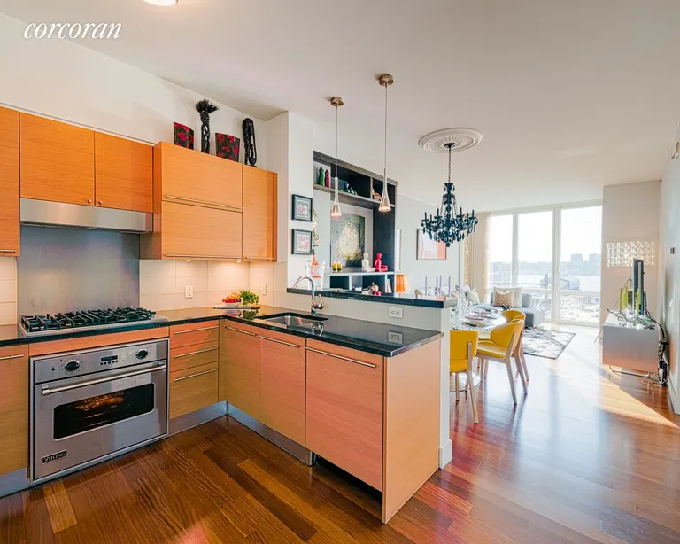 New York City Real Estate | View 10 West End Avenue, 8C | Chef's kitchen open to dining and living areas  | View 3