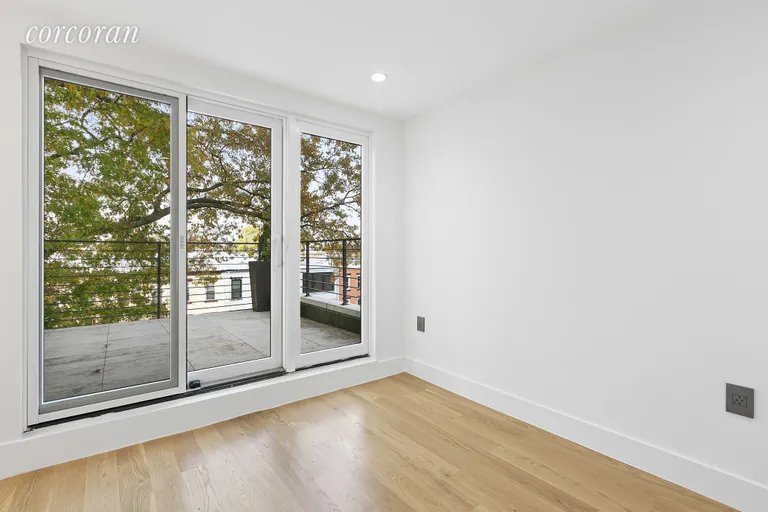 New York City Real Estate | View 213 Halsey Street, 4 | Large sliding glass doors to the private roof deck | View 3