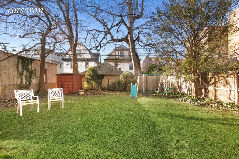 New York City Real Estate | View 262 77th Street | Expansive backyard lawn with mature trees | View 2