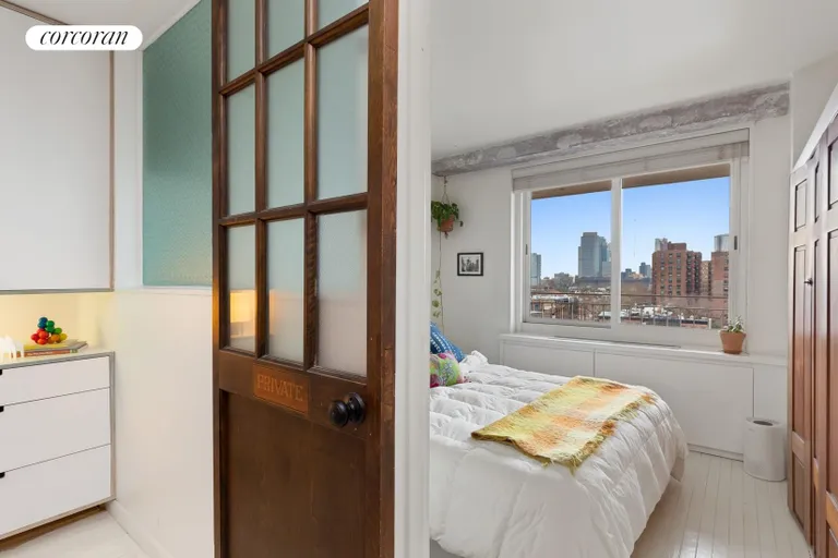 New York City Real Estate | View 185 Hall Street, 1008 | Bedroom has oversized windows + built-in storage | View 5