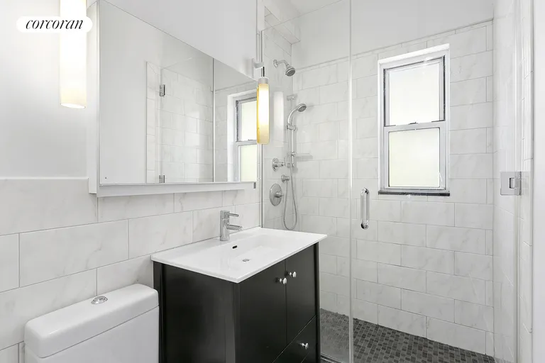 New York City Real Estate | View 77 East 12th Street, 17J | Window Bathroom and Washer Dryer | View 6
