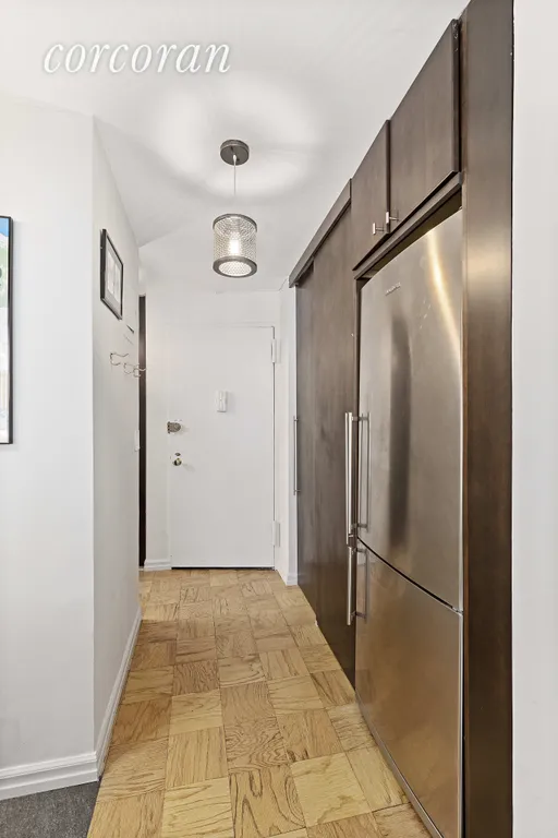 New York City Real Estate | View 7 East 14th Street, 1021 | Foyer with walls of closets and storage | View 4