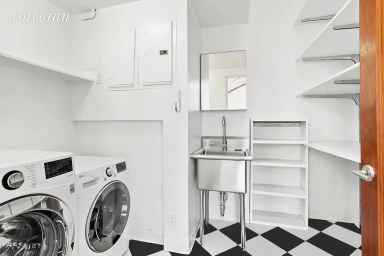 New York City Real Estate | View 8 East 12th Street, 8/9 | Full-Size Laundry Room + Storage | View 6