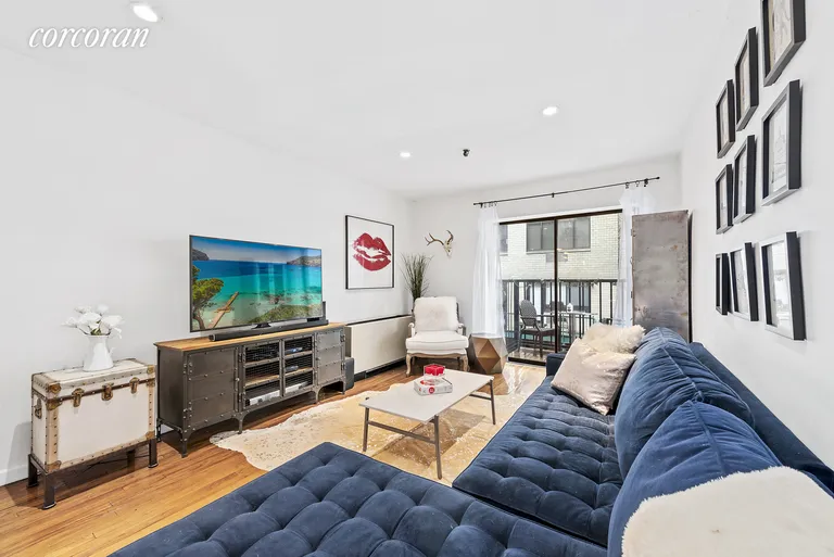 New York City Real Estate | View 67 East 11th Street, 204 | Spacious Living Room with Access to Balcony | View 3