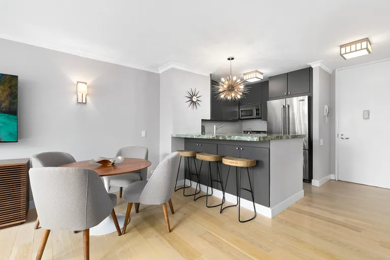 New York City Real Estate | View 45 West 67th Street, 27C | Open chefs kitchen with stainless appliances  | View 3