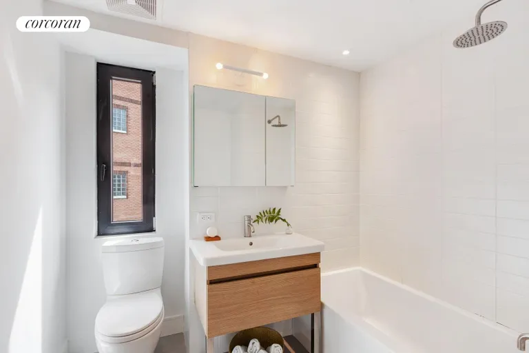 New York City Real Estate | View 1702 Newkirk Avenue, 5A | Crisp, windowed hall bathroom | View 7