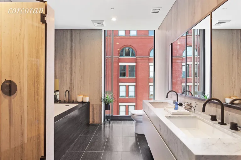New York City Real Estate | View 100 Barrow Street, 9B | Windowed Master Bath | Soaking Tub | Glass Shower  | View 13