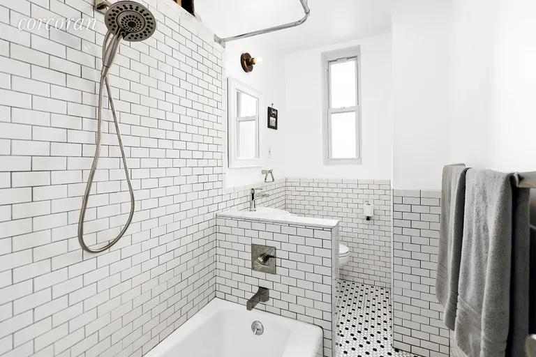 New York City Real Estate | View 415 9th Street, 41 | The guest bath features crisp black & white tile. | View 4