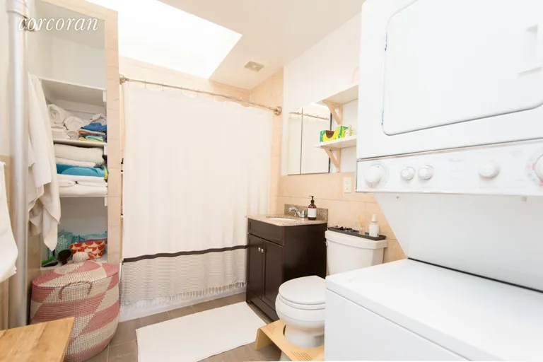 New York City Real Estate | View 2 Lincoln Place, 4R | Bathroom with Washer/ Dryer | View 8