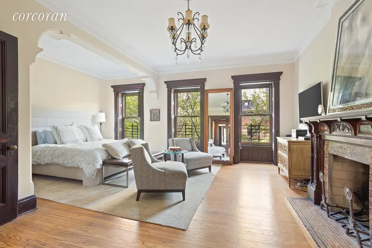 New York City Real Estate | View 57 Montgomery Place, 2 | Large master bedroom with wood-burning fireplace | View 7