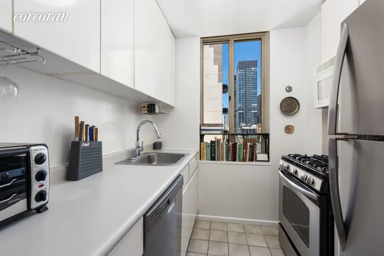 New York City Real Estate | View 236 East 47th Street, 28E | Windowed galley kitchen with full size appliances | View 2
