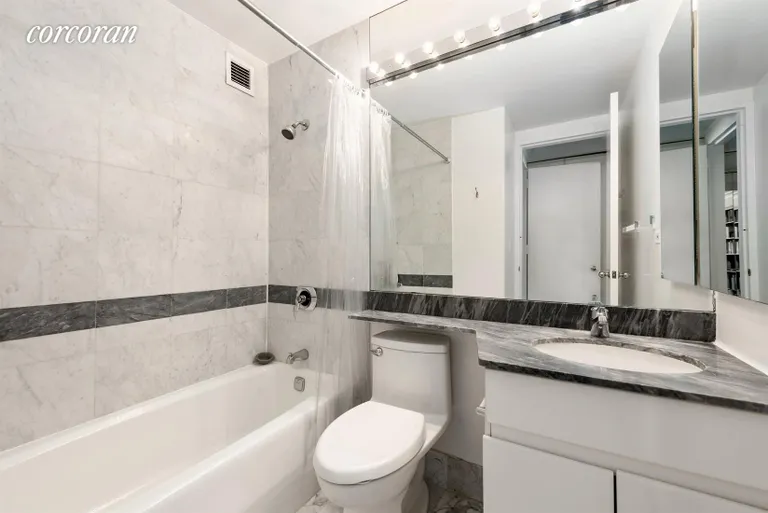 New York City Real Estate | View 236 East 47th Street, 28E | En suite marble master bathroom | View 4