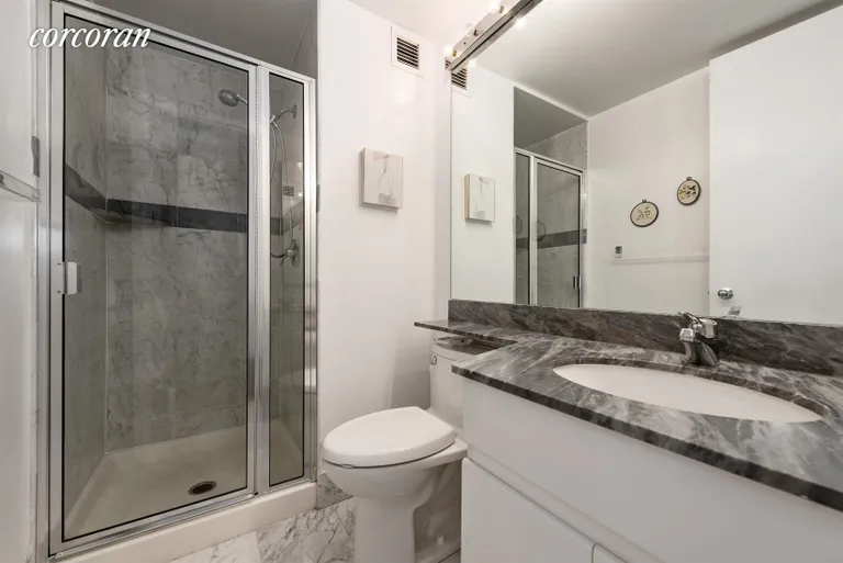 New York City Real Estate | View 236 East 47th Street, 28E | 2nd bathroom with marble finishes | View 6