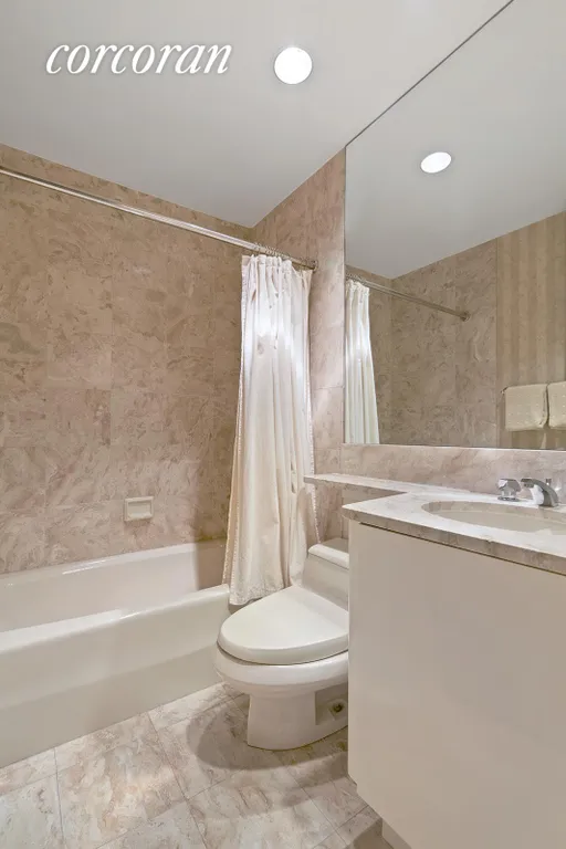New York City Real Estate | View 100 United Nations Plaza, 24A | Marble bathroom | View 6