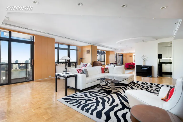 New York City Real Estate | View 100 United Nations Plaza, 33AB | Expansive living room with East River views | View 2