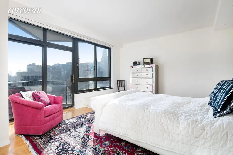 New York City Real Estate | View 100 United Nations Plaza, 33AB | Bedroom with private balcony and en suite bathroom | View 8