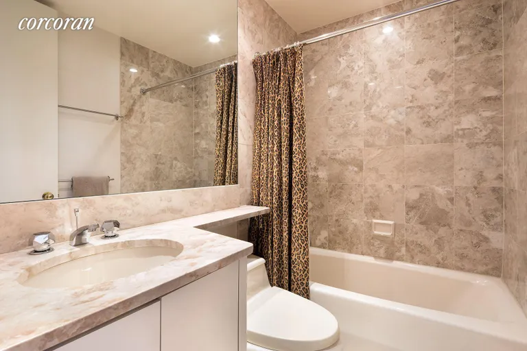 New York City Real Estate | View 100 United Nations Plaza, 33AB | Marble bathroom | View 9