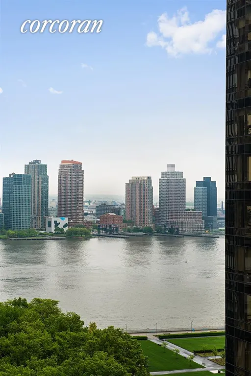 New York City Real Estate | View 100 United Nations Plaza, 22C | Balcony views to East River and Long Island City | View 6