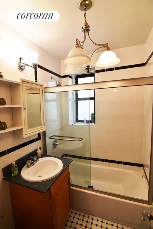 New York City Real Estate | View 315 East 77th Street, 1F | Glass-in Bath Tub and Windowed Bathroom | View 5