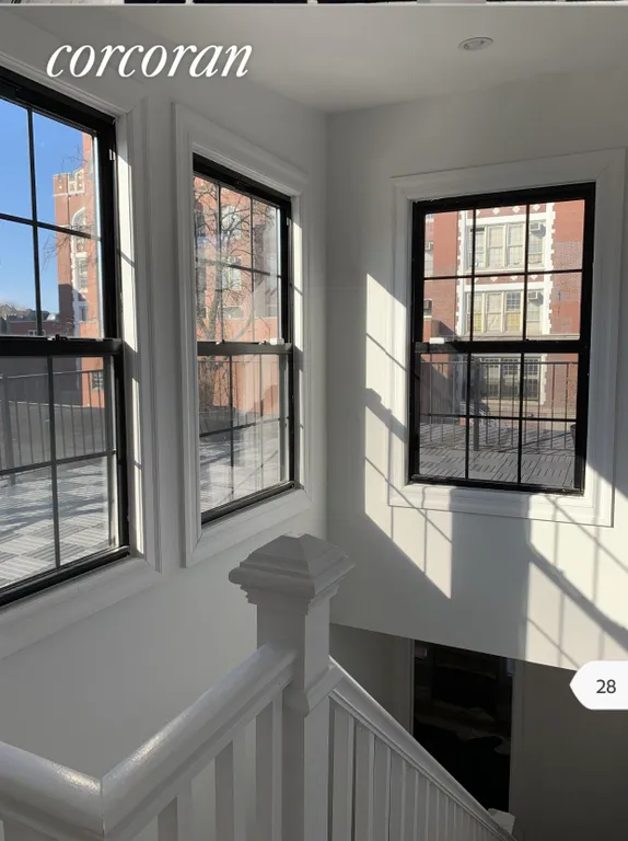 New York City Real Estate | View 4 Herkimer Court | Stairs to private roof deck  | View 17
