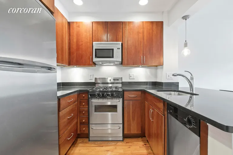 New York City Real Estate | View 165 Christopher Street, 4H | Open, Renovated Kitchen with Counter-Top Dining | View 4