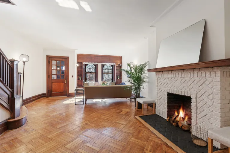 New York City Real Estate | View 30 Chester Court | Lovely wood burning fireplace | View 2