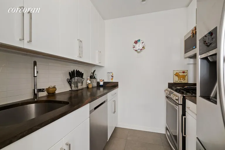 New York City Real Estate | View 100 United Nations Plaza, 37E | Renovated kitchen with stainless steel appliances | View 3