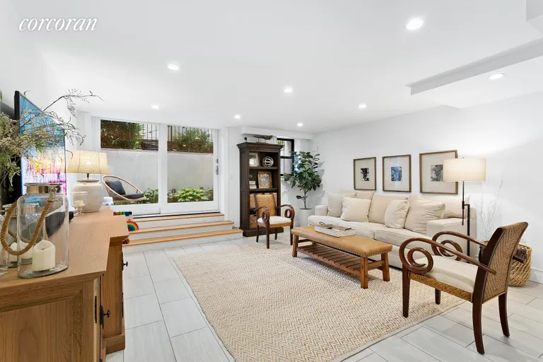New York City Real Estate | View 382 Prospect Place, 5 | Lounge away in this oversized rec room! | View 4
