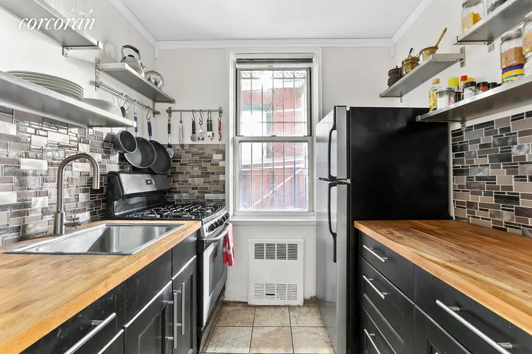 New York City Real Estate | View 245 Henry Street, 1A | Sunny windowed kitchen catches morning rays | View 4