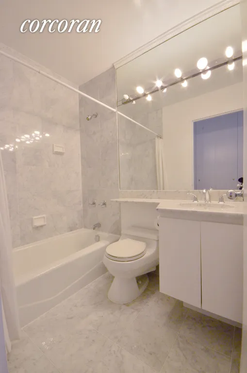 New York City Real Estate | View 45 East 25th Street, 27B | Two Carrera marble baths! | View 7