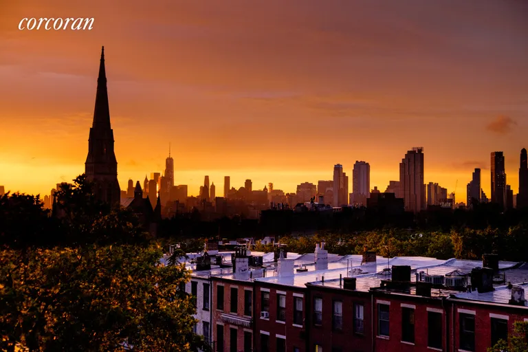 New York City Real Estate | View 140 8th Avenue, 6R | A nighttime view from the bedroom. | View 7